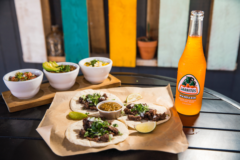 Tacos served with drink at the Little Taco Shop